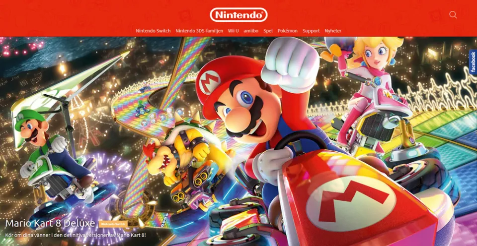 Website screenshot: red bar with white Nintendo logo and menu on top, below lively rendering montage with scenes from Super Mario. Main character in a red car in focus, foreward-raising a fist