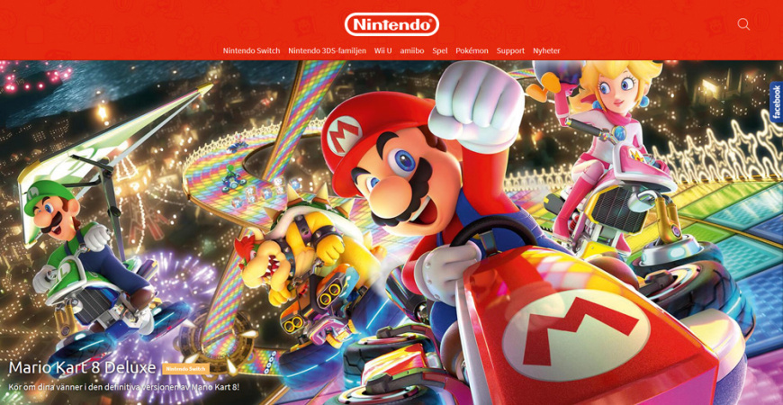 Website screenshot: red bar with white Nintendo logo and menu on top, below lively rendering montage with scenes from Super Mario. Main character in a red car in focus, foreward-raising a fist