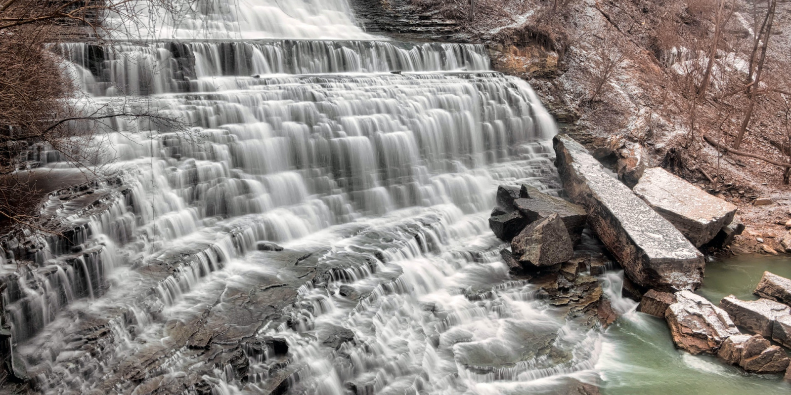 Photo: Waterfall in form of a wide cascade