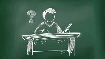 Person writing at a desk, illustration on a chalkboard